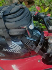 TrailHawk Motorcycle Tank Bag with Hydration Pack attached to a motorcycle tank during an adventure touring ride.