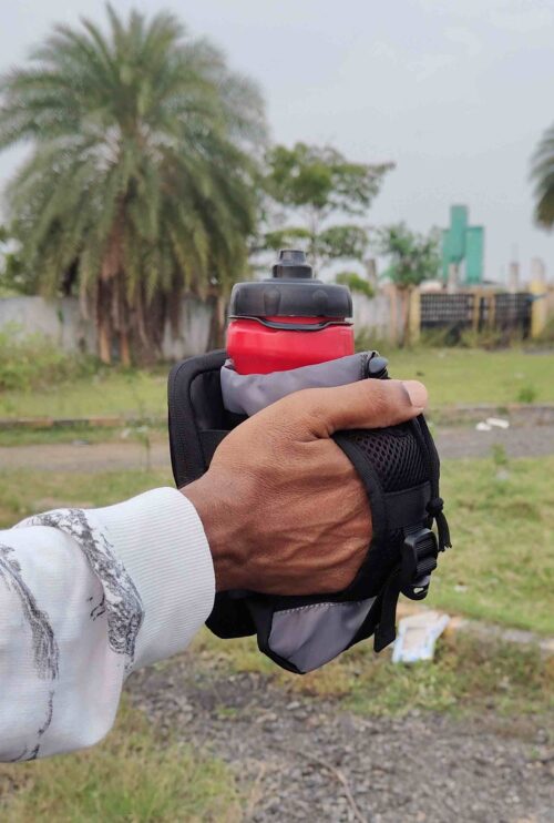 Handheld bottle and phone pouch